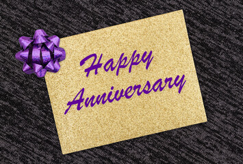 Happy Anniversary greeting gold glitter greeting card with purple bow