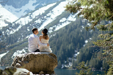Young couple has a love story in the mountains.