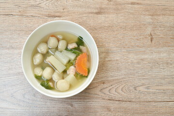 boiled radish with fish ball and mashed pork soup on bowl