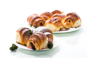 baked sweet homemade buns with plum inside