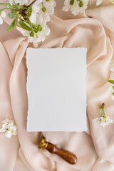 Mockup invitation, blank paper greeting card, floral background, flat lay