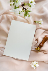 Mockup invitation, blank paper greeting card, floral background, flat lay