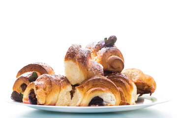 baked sweet homemade buns with plum inside