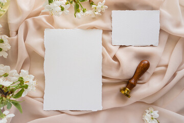Mockup invitation, blank paper greeting card, floral background, flat lay