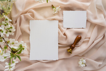 Mockup invitation, blank paper greeting card, floral background, flat lay