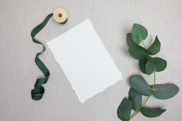 Wedding card mockup with eucalyptus and ribbon