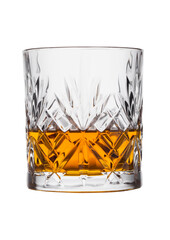 Scotch whiskey in crystal elegant glass on white background.