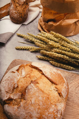 Artisan bread with wheat cereals on a stone table