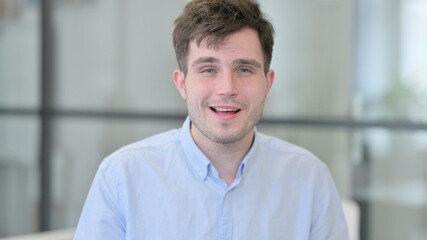 Obraz premium Portrait of Young Man Talking on Online Video Call 