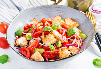 Tuscan Panzanella, traditional Italian salad with tomatoes and bread. Vegetarian panzanella salad. Mediterranean healthy food.
