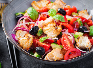 Tuscan Panzanella, traditional Italian salad with tomatoes and bread. Vegetarian panzanella salad. Mediterranean healthy food.