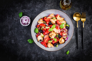 Tuscan Panzanella, traditional Italian salad with tomatoes and bread. Vegetarian panzanella salad. Mediterranean healthy food. Top view, copy space