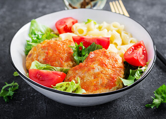 Creste pasta and chicken meatballs in tomato sauce.