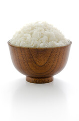 Jasmine-cooked rice has a pleasant aroma in a wood bowl isolated on white background, Suitable as a design element.