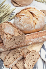 Artisan bread with wheat cereals on a stone table