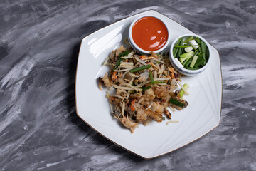 Fork to scoop fried mussels with crispy flour with bean sprouts. Thai food