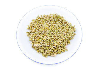 Sprouted buckwheat seeds on a white plate isolated. Healthy vegan food. Vegetarian food. Nature vitamins. Super food
