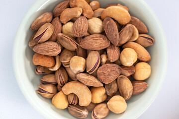 mixed nuts on white background. top view