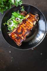 fried ribs meat pork beef or lamb marinated sauce hot spices trend meal snack copy space food background rustic. top view