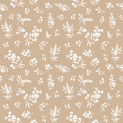 Vector seamless pattern. Pretty pattern in small flowers. Small white flowers. light beige background. Ditsy floral background. The elegant the template for fashion prints.