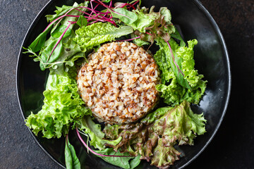 buckwheat and salad fresh green mix salad lettuce trend diet meal snack copy space food background rustic. top view keto or paleo diet vegan or vegetarian food