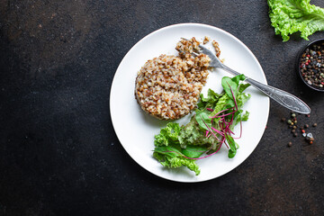 buckwheat and salad fresh green mix salad lettuce trend diet meal snack copy space food background rustic. top view keto or paleo diet vegan or vegetarian food