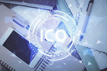 Double exposure of blockchain theme hologram over table with phone. Top view. Crypto technology...
