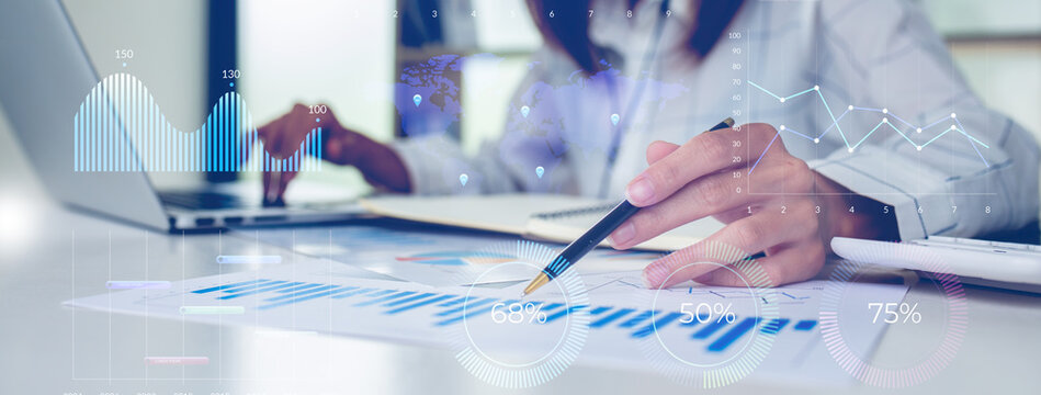 Financial Businesswomen analyze the graph of the company's performance to create profits and growth, Market research reports and income statistics, Financial and Accounting concept.