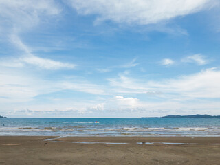 Sandy beaches and seas with soft white clouds, blue skies, Thailand's summer beaches.