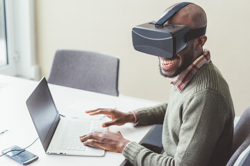 Young afro man using computer 3D viewer
