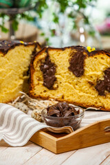 Panettone is the traditional Italian dessert for easter in 2021. Homemade panettone covered in chocolate and sprinkles. Bread served as dessert.