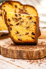 Panettone is the traditional Italian dessert for easter in 2021. Homemade panettone covered in chocolate and sprinkles. Bread served as dessert.