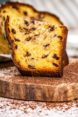 Panettone is the traditional Italian dessert for easter in 2021. Homemade panettone covered in chocolate and sprinkles. Bread served as dessert.