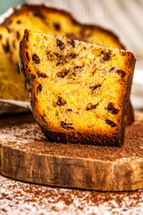 Panettone is the traditional Italian dessert for easter in 2021. Homemade panettone covered in chocolate and sprinkles. Bread served as dessert.