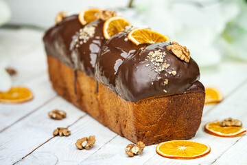 Panettone is the traditional Italian dessert for easter in 2021. Homemade panettone covered in chocolate and sprinkles. Bread served as dessert.