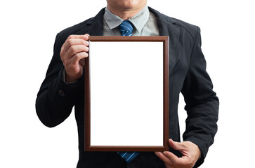 A blank diploma or a mockup certificate in the hand of a male employee wearing a black suit on white background with a clipping path. The picture frame is empty and the copy space. selective focus.
