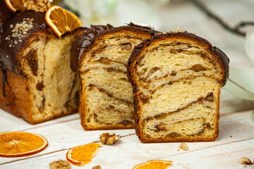 Panettone is the traditional Italian dessert for easter in 2021. Homemade panettone covered in chocolate and sprinkles. Bread served as dessert.