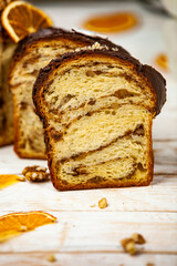 Panettone is the traditional Italian dessert for easter in 2021. Homemade panettone covered in chocolate and sprinkles. Bread served as dessert.