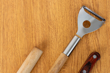 Kitchen utensils on a wooden background