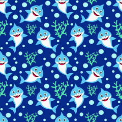 Seamless pattern with cute smilling baby shark with coral on dark blue background.