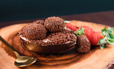Chocolate Easter Egg filled with brigadeiro (brigadier) and strawberries, Goumert egg chocolate tradition in Brazil.