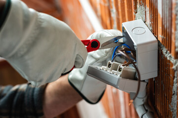 Electrician at work on a residential electrical system. Electricity.