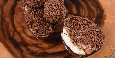 Chocolate Easter Egg filled with powdered milk brigadeiro (brigadier), Goumert egg chocolate tradition in Brazil.