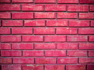 Red brick wall background with vignette effect