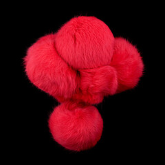 Close up of red rabbit fur pompoms isolated on black background