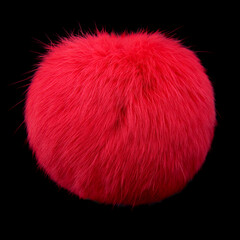 Close up of red rabbit fur pompom isolated on black background