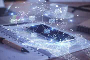 Double exposure of envelope sketch over cell phone background. Concept of sms