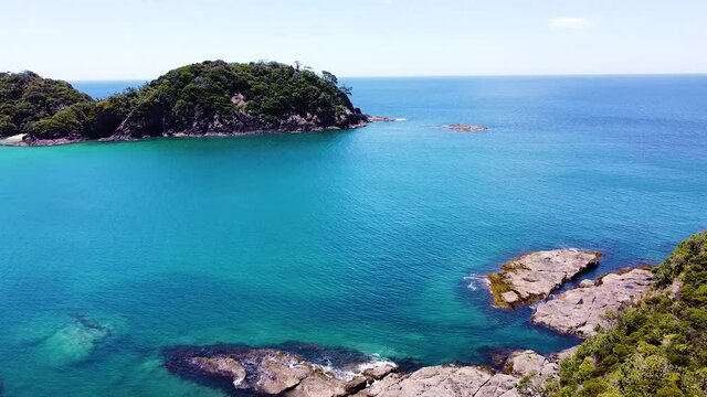 Aerial shot of the rocks and ocean, Matapouri Bay New Zealand