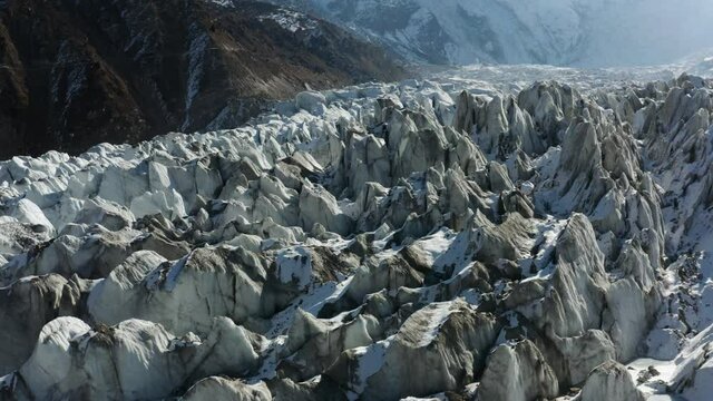 Rocky Surface Covered With Snow At Raikot Glacier In Nanga Parbat's North Flank, Northern Pakistan. - Low Aerial