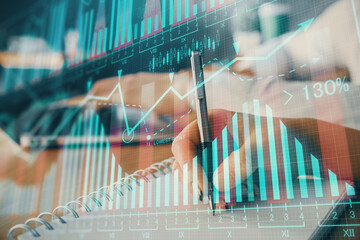 Double exposure of forex chart drawing over people taking notes background. Concept of financial...
